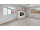 Bright living room showcasing a decorative fireplace, tile flooring, recessed lighting, and fresh white paint at 8301 E Indianola Ave, Scottsdale, AZ 85251