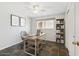 A home office featuring a sleek desk setup, modern decor, and ample natural light for a productive workspace at 8301 E Indianola Ave, Scottsdale, AZ 85251