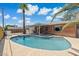 This backyard boasts a sparkling pool, covered patio, and lush landscaping at 8301 E Indianola Ave, Scottsdale, AZ 85251