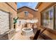 Inviting backyard features a built-in BBQ area, fire pit, and cozy seating at 84 E Joseph Way, Gilbert, AZ 85295