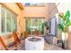 Serene backyard featuring a water feature, fire pit, and comfortable seating area at 84 E Joseph Way, Gilbert, AZ 85295