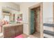 Attractive bathroom featuring a large vanity, a tiled stand-up shower, and modern fixtures at 84 E Joseph Way, Gilbert, AZ 85295