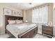 Comfortable bedroom with a ceiling fan, ample lighting, and a large bed at 84 E Joseph Way, Gilbert, AZ 85295