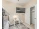 Neutrally decorated bedroom with a TV mounted on the wall, alongside a small white accent table at 84 E Joseph Way, Gilbert, AZ 85295