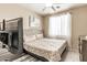 Serene bedroom with a tufted headboard bed, soft patterned bedding, and window with sheer curtains at 84 E Joseph Way, Gilbert, AZ 85295