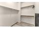 Walk-in closet with shelves and hanging rods, providing ample storage space in an organized, white interior at 84 E Joseph Way, Gilbert, AZ 85295