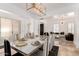 Dining room with marble dining table and luxury decor, leading to the living room at 84 E Joseph Way, Gilbert, AZ 85295