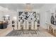 Dining room with an elegant modern table, black and white artwork, and stylish chandelier lighting at 84 E Joseph Way, Gilbert, AZ 85295