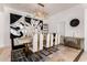 Elegant dining room features stylish chandelier, modern art, and seating for six at 84 E Joseph Way, Gilbert, AZ 85295