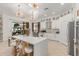 Bright, modern kitchen with white cabinets, quartz countertops, and a large island with seating at 84 E Joseph Way, Gilbert, AZ 85295
