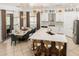 Bright open kitchen with island, marble countertops, stainless steel appliances, modern lighting, and breakfast nook at 84 E Joseph Way, Gilbert, AZ 85295