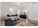 Contemporary living room with neutral color palette, statement lighting, plantation shutters, and marble accents at 84 E Joseph Way, Gilbert, AZ 85295