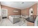 Spacious living room featuring a large sectional sofa, stylish decor, and light wood floors at 84 E Joseph Way, Gilbert, AZ 85295