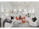 Spacious living room with bright lighting, curved sofas, and statement lighting fixtures, perfect for gatherings at 84 E Joseph Way, Gilbert, AZ 85295