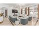 Stylish living room with a fireplace, mounted TV, elegant sofas, and modern decor at 84 E Joseph Way, Gilbert, AZ 85295