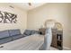 Well-lit home office featuring a large desk and comfortable seating area at 84 E Joseph Way, Gilbert, AZ 85295