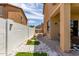 Stylish side yard with pavers, artificial turf, and rock accents, offering a private outdoor space at 84 E Joseph Way, Gilbert, AZ 85295