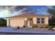 Charming single-story home with stone accents, a two-car garage, and low maintenance desert landscaping at 8836 W Orange Dr, Glendale, AZ 85305