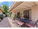 Covered patio with a wrought iron dining set, perfect for enjoying outdoor meals at 912 W Sunward Dr, Gilbert, AZ 85233