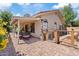 Outdoor patio area with wrought iron dining set and wooden pet gate at 912 W Sunward Dr, Gilbert, AZ 85233