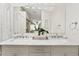 Bathroom showcasing double sinks, a vanity with ample storage, and a luxurious mirror, offering both style and functionality at 912 W Sunward Dr, Gilbert, AZ 85233