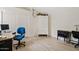 Bright bedroom with a large closet, wood-look floors, and a versatile workspace with a modern desk at 912 W Sunward Dr, Gilbert, AZ 85233
