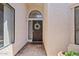 The front door of a home that is adorned with decorative windows and a wreath at 912 W Sunward Dr, Gilbert, AZ 85233