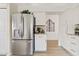 Modern kitchen with stainless steel refrigerator, white cabinetry, and stylish countertop decor at 912 W Sunward Dr, Gilbert, AZ 85233
