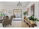 Bright and airy living area with sliding glass doors leading to a private patio, stylish furnishings, and a cozy seating area at 912 W Sunward Dr, Gilbert, AZ 85233
