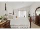 Bright and airy bedroom with a four poster bed, side tables, and a vanity with a mirror, creating a comfortable space at 912 W Sunward Dr, Gilbert, AZ 85233