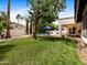 Lush backyard featuring mature trees, seating, and a sparkling pool, ideal for relaxation and entertainment at 9637 E Gold Dust Ave, Scottsdale, AZ 85258