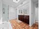 Bright bathroom with a double vanity, tile floor, and glass-enclosed shower at 9637 E Gold Dust Ave, Scottsdale, AZ 85258