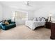 Relaxing bedroom with white walls, carpeted floor, and ceiling fan at 9637 E Gold Dust Ave, Scottsdale, AZ 85258