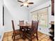 Cozy dining area featuring a round table, wooden chairs, and natural light from a window at 9637 E Gold Dust Ave, Scottsdale, AZ 85258