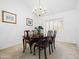 Elegant dining room with hardwood table, upholstered chairs, and chandelier at 9637 E Gold Dust Ave, Scottsdale, AZ 85258