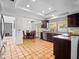 Bright kitchen featuring tile flooring, stainless steel appliances, and an adjacent dining area at 9637 E Gold Dust Ave, Scottsdale, AZ 85258