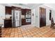 Bright kitchen with stainless steel appliances and dark wood cabinets, with tile floors at 9637 E Gold Dust Ave, Scottsdale, AZ 85258