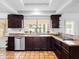 Well-lit kitchen featuring stainless steel appliances, granite countertops and tile flooring at 9637 E Gold Dust Ave, Scottsdale, AZ 85258