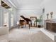 Spacious living room with bright windows, fireplace and grand piano at 9637 E Gold Dust Ave, Scottsdale, AZ 85258
