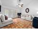 Spacious living room with tile floors, ceiling fan, and bright lighting at 9637 E Gold Dust Ave, Scottsdale, AZ 85258