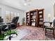 Inviting home office featuring a large desk, bookshelves, and comfortable seating at 9637 E Gold Dust Ave, Scottsdale, AZ 85258