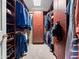 Organized walk-in closet with built-in shelves and ample hanging space at 9637 E Gold Dust Ave, Scottsdale, AZ 85258