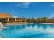 Large community pool with clear blue water and plenty of seating at 9801 W Rockwood Dr, Peoria, AZ 85382