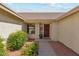 Inviting front entrance with decorative wooden door, well-kept landscaping, and a welcoming walkway at 9801 W Rockwood Dr, Peoria, AZ 85382