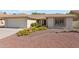 Charming single story home with a well-maintained front yard and attached two car garage at 9801 W Rockwood Dr, Peoria, AZ 85382