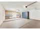 Spacious garage featuring built-in storage cabinets and epoxy flooring at 9801 W Rockwood Dr, Peoria, AZ 85382
