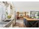Well-appointed kitchen with stainless steel appliances, butcher block island, and views into the dining area at 9801 W Rockwood Dr, Peoria, AZ 85382