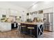 Bright kitchen with stainless steel appliances, center island with seating, and white cabinetry at 9801 W Rockwood Dr, Peoria, AZ 85382