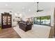 Spacious living area featuring a modern design, open floor plan, and seamless indoor-outdoor transition at 9801 W Rockwood Dr, Peoria, AZ 85382
