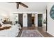 Attractive main bedroom with wood floors, barn doors to bath and closet and ceiling fan at 9801 W Rockwood Dr, Peoria, AZ 85382
